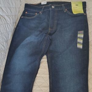 Levi's Flex Slim Fit Jeans in Deep Blue. Pants